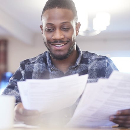 A man reads a financial award letter